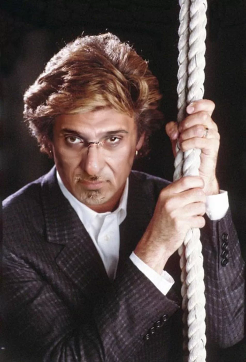 Man holding rope (serious expression)